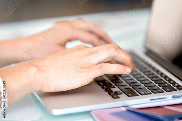 Fototapeta Image of woman's hands typing