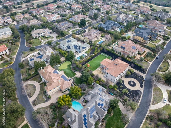 Fototapeta Aerial images over an affluent community in the Bay Area, with mansions, cars, solar, pools