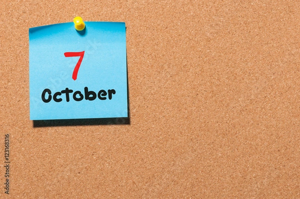 Fototapeta October 7th. Day 7 of month, color sticker calendar on notice board. Autumn time. Empty space for text