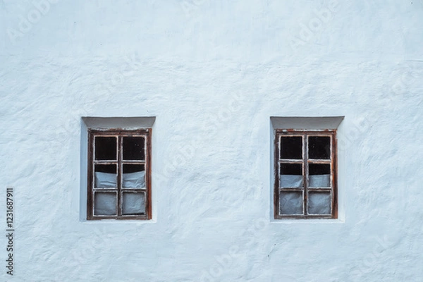 Obraz Minimalist aesthetic of two symmetrical windows of an old Ukrainian whitewashed house