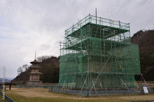 Fototapeta The East and West Three-story Stone Pagodas at the Gameunsa Temple Site in Gyeongju, Korea, are currently undergoing preservation treatment due to severe damage.