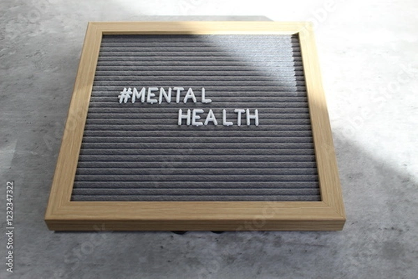 Fototapeta Mental health written out on a letter board in white letters. 
