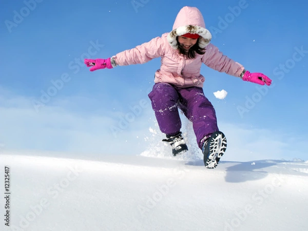 Fototapeta Young Girl Playing in Snow