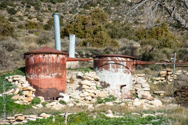 Obraz Old stills to distill the essence of aromatic plants