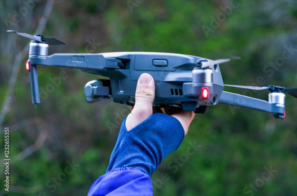 Fototapeta drone in hand, ready to land