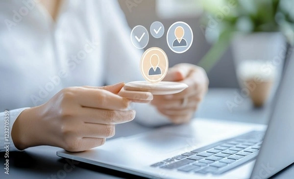 Fototapeta A person interacts with a digital interface, showcasing user profiles and verification icons while sitting at a desk with a laptop.