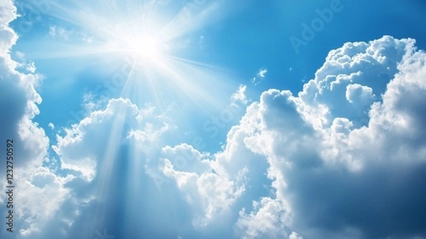 Fototapeta Bright Sunlight Breaking Through Soft Clouds in a Clear Blue Sky