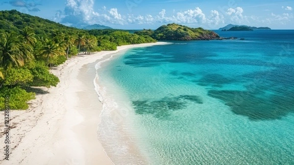 Fototapeta A beautiful beach with a clear blue ocean in the background
