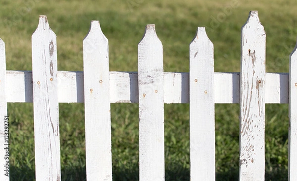 Fototapeta white wooden fence on nature
