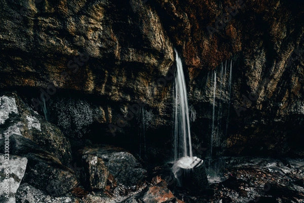 Fototapeta water falling from a cliff