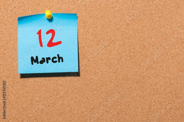 Fototapeta March 12th. Day 12 of month, calendar on cork notice board background. Spring time, empty space for text