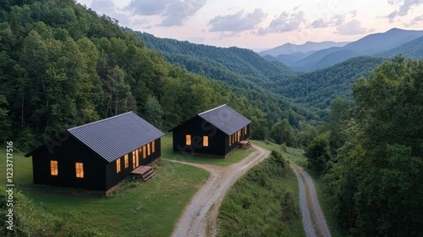Fototapeta Serene Mountain Cabins with Warm Glow at Dusk