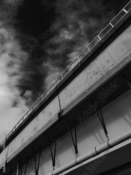 Obraz Highway overpass with cloudy sky in black and white tone.
