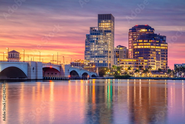 Obraz West Palm Beach, Florida, USA. Cityscape image of West Palm Beach, Florida with reflection of the city skyline in the water at beautiful sunset.
