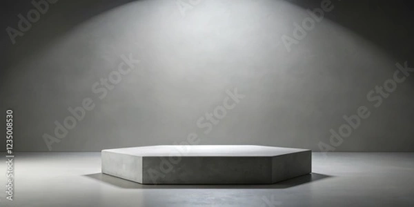 Fototapeta A hexagonal concrete podium with a soft, diffused light shining from above, creating a dramatic and minimalist backdrop for product display.