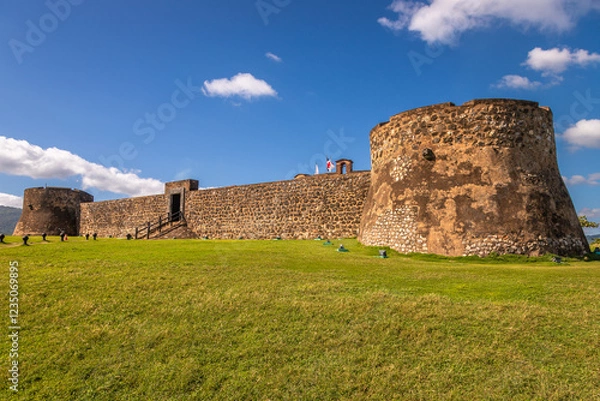 Fototapeta Exposure of the Fortaleza de San Filipe, an historic Spanish fortress used to protect the city of Puerto Plata from pirates, and is located on a hill near the seaport, Dominican Republic