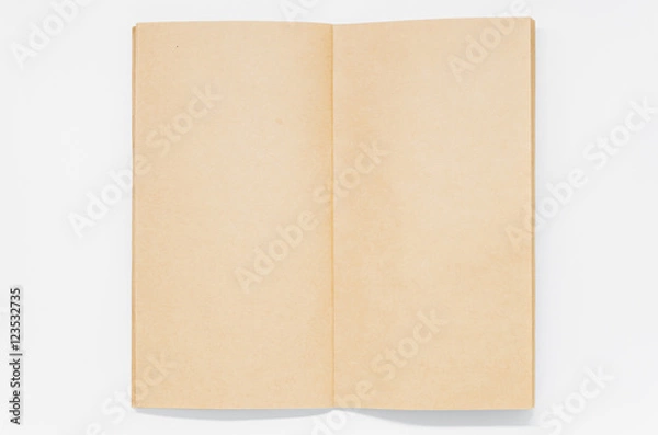 Fototapeta Opened Brown plain notebook on white background and selective focus