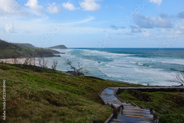 Obraz A Path to the Sea: Coastal Walkway and Ocean View