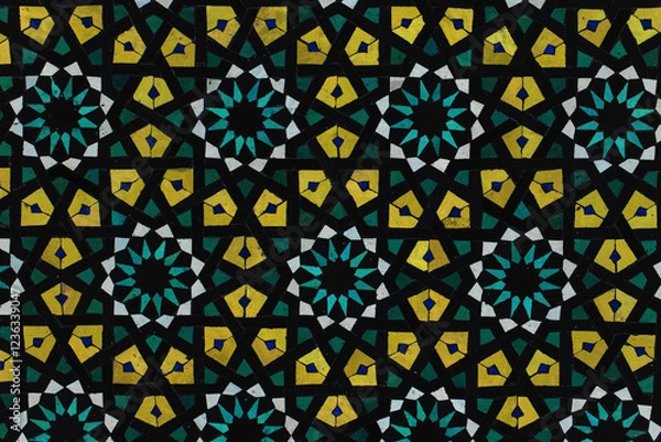 Fototapeta A detailed Islamic geometric mosaic featuring vibrant colors and symmetrical patterns. The design showcases traditional arabesque motifs with star shapes and interwoven lines