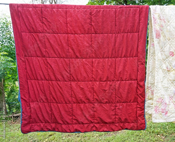 Obraz red blanket hanging on a clothesline