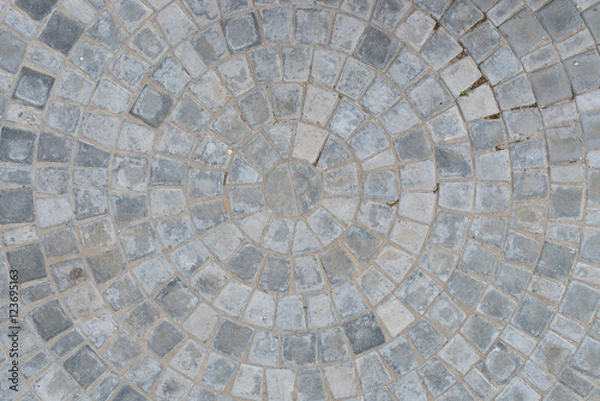 Fototapeta Cobble circular pattern block pavement texture background. Top view