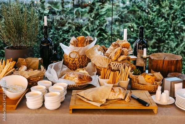 Obraz Elegant rustic bread and snack table with fresh artisanal bread and breadsticks.