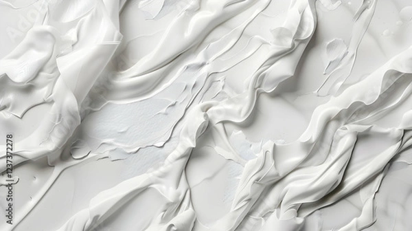 Fototapeta A textured surface of white material with smooth, flowing patterns.