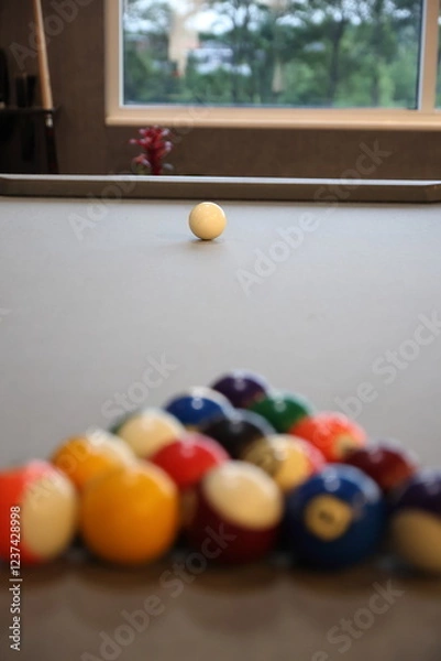 Fototapeta Pool balls lined up to be broken on a billiards table
