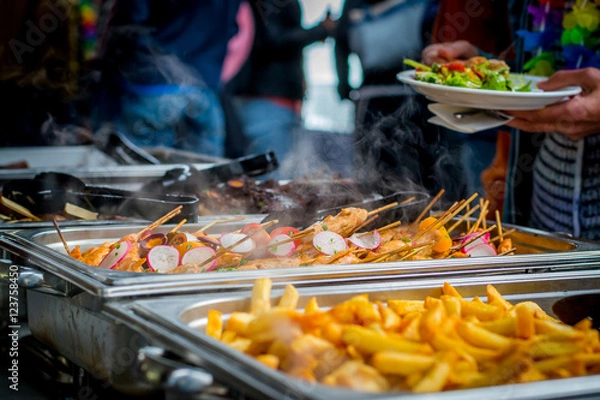 Obraz Delicious buffet in a restaurant with meat and fries
