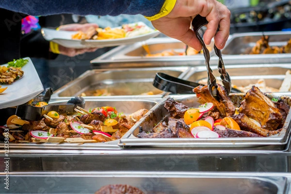 Obraz Delicious buffet in a restaurant with meat and fries