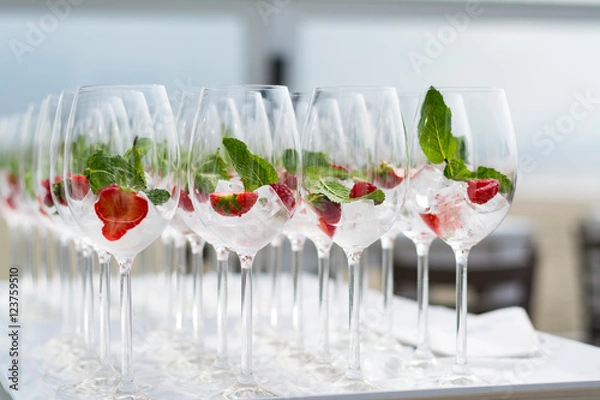 Obraz Cocktail glasses with strawberries and ice at a ceremonie