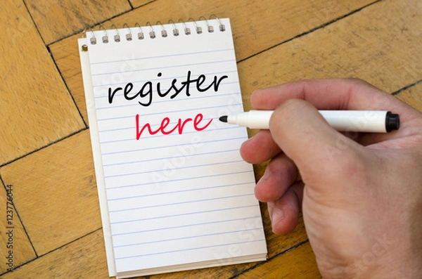 Fototapeta Register here text concept on notebook