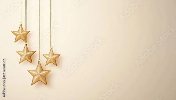 Fototapeta Elegant golden stars hanging against a soft beige background, creating a festive atmosphere