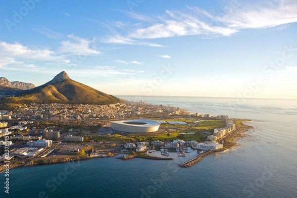 Fototapeta Aerial sunset view of the beautiful city of  Cape Town, South Africa, as seen from above. Table Mountain and Lions Head clearly visible in the background 