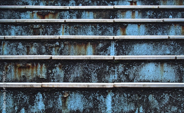 Obraz Close-up head-on view of part of a rusty metal blue-painted outdoor staircase