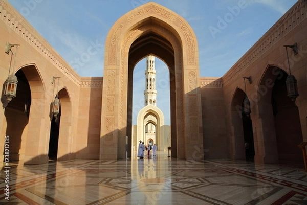 Obraz The main entrance to Sultan Qaboos Grand Mosque for Muslims in Muscat, Oman, with patterned tiles and reflections