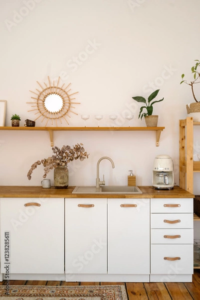 Obraz Stylish boho kitchen with wooden accents and minimalist design elements