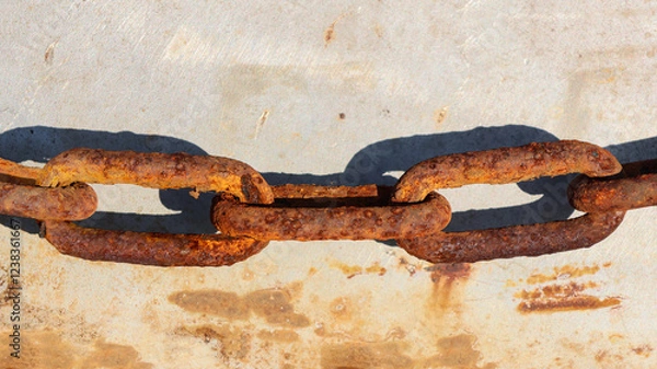 Fototapeta Close up shot of an old rusty chain.