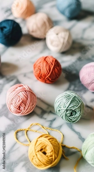 Obraz Knitting. Balls of cotton and wool yarn in warm tones on a white table. Boho, bed tones, orange, pink, turquoise, hobby