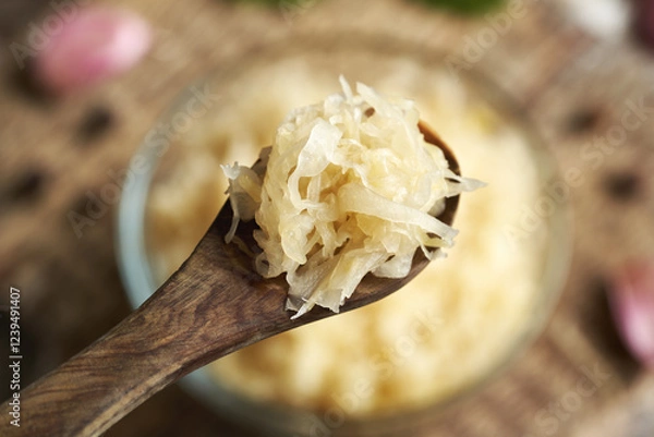 Fototapeta Homemade fermented cabbage or sauerkraut on a spoon
