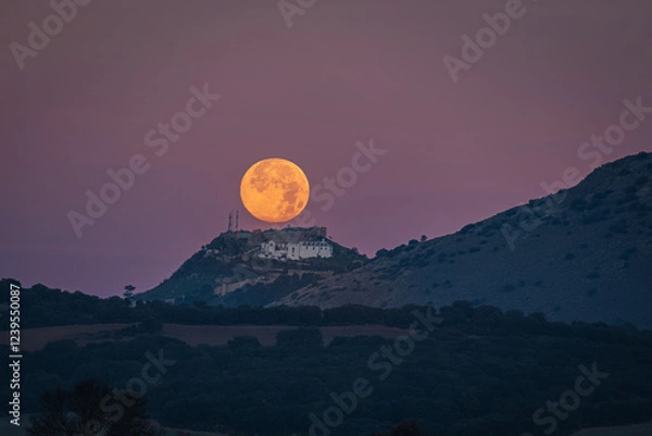 Obraz Sunset of the Moon over the castle of Archidona. Malaga. Spain.
