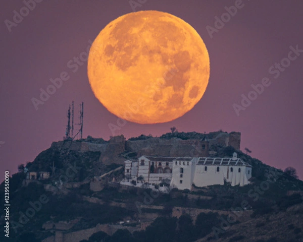 Obraz Sunset of the Moon over the castle of Archidona. Malaga. Spain.