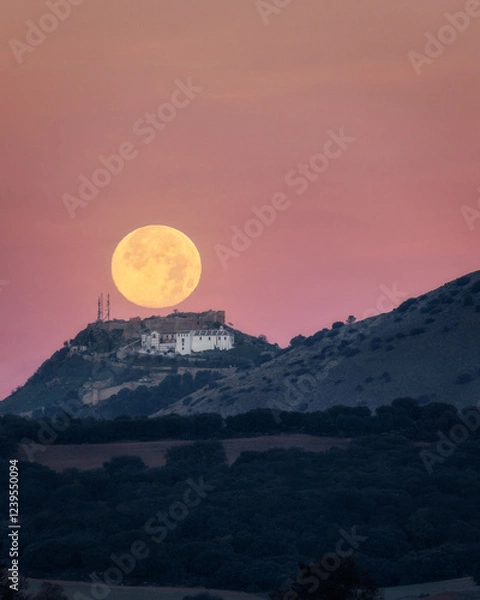 Obraz Sunset of the Moon over the castle of Archidona. Malaga. Spain.