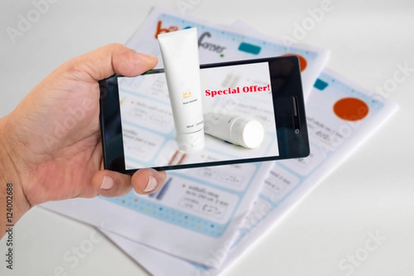 Obraz Augmented reality marketing concept. Hand holding smart phone to use A/R application to product detials for A/R catalog.