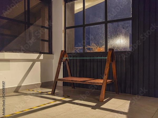 Fototapeta A wooden chair by window with beautiful light