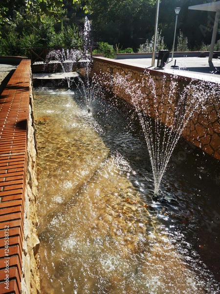 Obraz Charming Garden Fountain with Sunlit Water Streams
