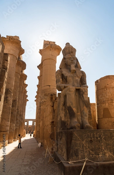 Fototapeta Luxor, Egypt - 9 February 2021: Tourists next to columns in Luxor Temple
