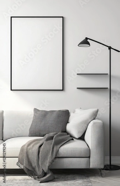Fototapeta A modern living room with a light grey sofa, a black floor lamp, and a shelf on the right side of a picture frame. The poster frame on the wall is blank. 