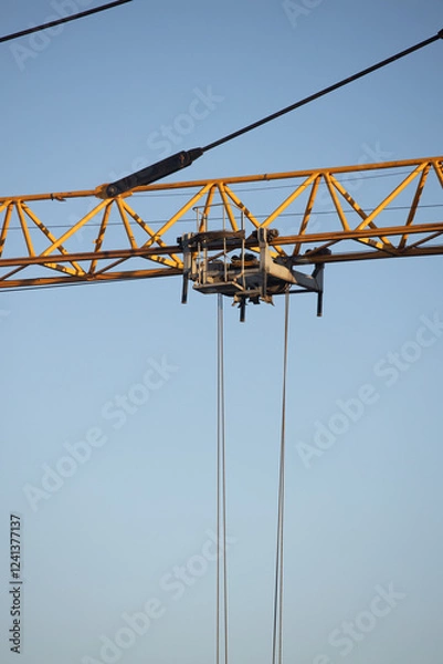 Obraz  Construction Yellow crane against blue sky