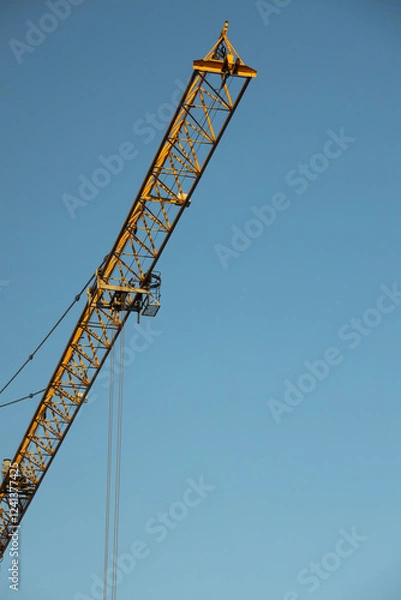 Obraz  Construction Yellow crane against blue sky
